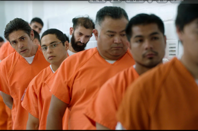 Young immigrants dressed in orange jumpsuits, who have been arrested by Border Patrols.